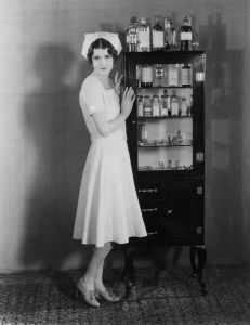 Vintage picture of nurse and medicine cabinet